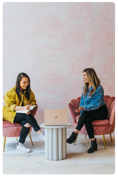 Teacher mentoring students in a classroom
